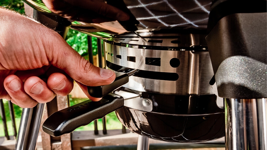 Close-up of Broil King Crown Charcoal Kettle BBQ 47cm ash management system with Roto Draft ventilation control