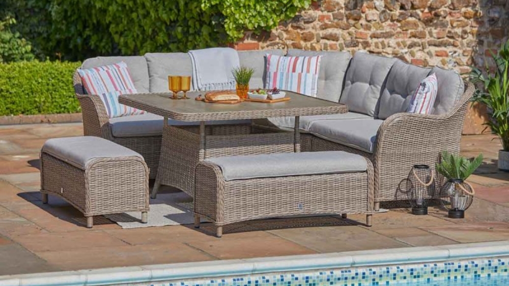 LG St Tropez Sand large square modular sofa set with cushioned seating and casual dining table in a garden patio setting