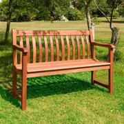 Alexander Rose Cornis Broadfield 4ft hardwood garden bench with curved slatted back and seat in oiled mahogany finish on grass