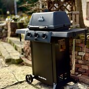 The Broil King Gem 310 Shadow Gas BBQ shown outdoors