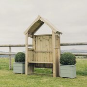 Churnet Valley 2 Seater Poppy Garden Arbour in a garden environment
