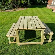 Butchers table set in a garden environment from a higher angle, showing the timber off properly