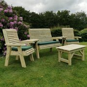 Churnet Valley Ergo Outdoor Coffee Table & 4 Seater Set in a garden, full image of the whole set as a collective on a lower angle