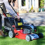 Cobra M40SPCVX petrol lawnmower with 50 litre grass collector being removed for emptying
