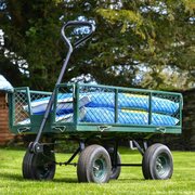 Cobra GCT320HD in use carrying bags of soil in a garden environment