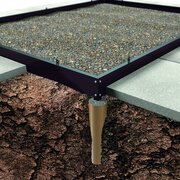 Galvanised steel base frame for the Halls ICON 6 6x10 greenhouse, shown anchored securely into prepared soil to provide a rigid, accurately aligned foundation.