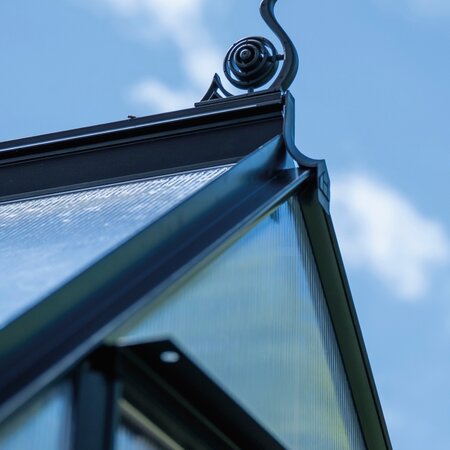 Halls ICON 6 6x10 greenhouse capping for polycarbonate installed along the roof edge, shown with decorative cresting fitted to a new ICON greenhouse.