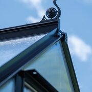 Halls ICON 6 6x10 greenhouse capping for polycarbonate installed along the roof edge, shown with decorative cresting fitted to a new ICON greenhouse.