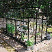 Halls Icon 6 6x8 greenhouse in black with toughened glass, shown as a freestanding garden greenhouse. Pre-order and save £327.