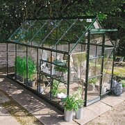Halls Icon 6 6x10 greenhouse in green with toughened glass, shown as a freestanding garden greenhouse. Pre-order and save £327.