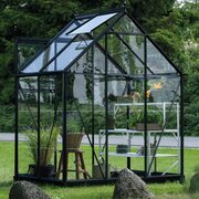 Halls Icon 6 6x4 Greenhouse in black, installed in a garden. Pre-order and save £267.