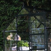 Open sliding door on the Halls Icon 6 6x6 greenhouse, with black aluminium frame and toughened glass glazing.