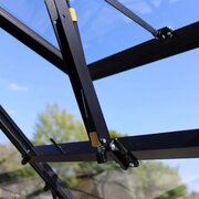 Automatic roof vent opener fitted inside the Halls Icon 6 6x6 greenhouse for temperature-controlled ventilation.