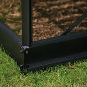 Halls ICON 6 Gardenhouse 6x12 installed on the matching galvanised steel base HR01188, showing the black base frame supporting the aluminium Gardenhouse on grass.