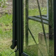 Halls Icon downpipe kit fitted to ICON greenhouse with interior staging visible through glass panels.