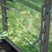 Interior view of Halls ICON greenhouse standard louvre kit fitted opposite the door for balanced ventilation.