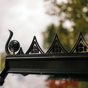 Decorative Halls ICON Planthouse 8 greenhouse roof cresting HR01965 installed along the ridge of an Planthouse 8 8x12 greenhouse, with the black finial scroll detail visible at the end.