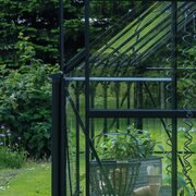 Halls ICON planthouse and lean-to downpipe kit HR01901 installed on an ICON greenhouse for controlled rainwater drainage.