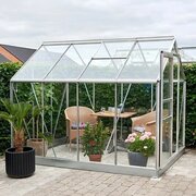 Side view of the Halls Popular 8x6 aluminium greenhouse with toughened glass panels, roof vent and spacious growing area.