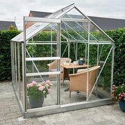 Halls Popular 8x6 aluminium greenhouse with toughened glass, sliding door and roof vent installed on a paved garden patio.