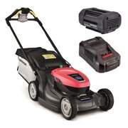 Honda HRX 476 XB cordless self-propelled lawnmower with grass bag, shown with the 6Ah battery and CV3680XA fast charger on a white background.