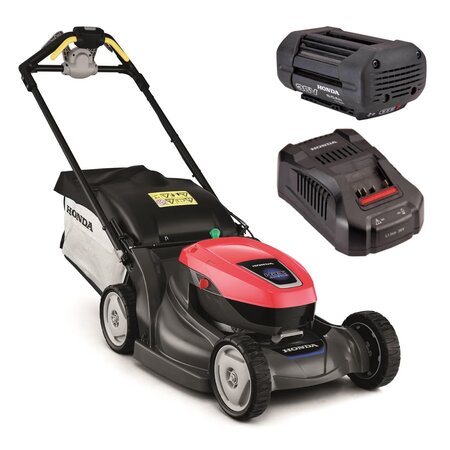 Honda HRX 476 XB cordless self-propelled lawnmower with grass bag, shown with the 6Ah battery and CV3680XA fast charger on a white background.