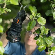 Husqvarna Aspire PS30X-P4A battery secateurs pruning tree branches in a garden