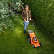 Husqvarna LC 137i + B140 Battery & C80 Charger in use in a garden environment