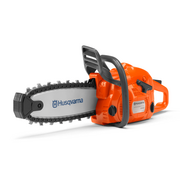 The chainsaw from the Husqvarna Toy Chainsaw Kit shown in a studio environment