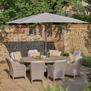 LG St Tropez Sand 8 Seat Garden Dining Set & 3m Parasol in garden environment