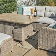 Rectangular table from the LG St Tropez Sand modular sofa set with ceramic-coated, wood-effect surface and woven rattan base, styled outdoors.