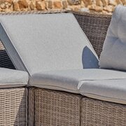 LG St Tropez Sand modular garden sofa with corner section in reclined position, showing supportive back cushions and woven rattan frame.