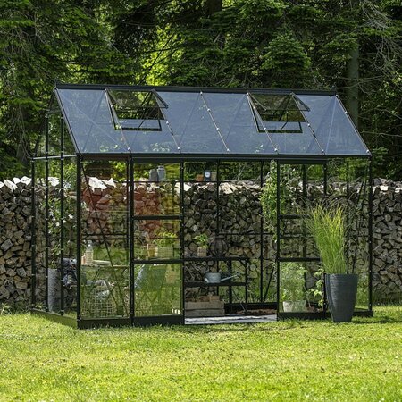 Installed Halls Icon 6 6x12 planthouse with black frame and full glass panels, shown fully assembled.