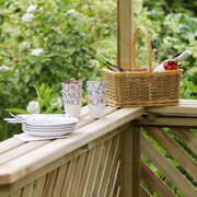 Inside the Zest 4 Broxton BBQ shelter in a garden close up on mugs
