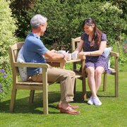 Caroline Garden Love Seat  Companion Seat with two people enjoying the sit down on them