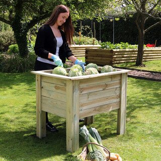 1m Deep Root Planter Deep Veg Bed - lady planting veg in the planter