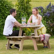 Two people enjoying their lunch ojn the Katie Round Picnic Table