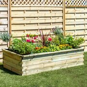 Large Sleeper Raised Bed with flowers inside of it