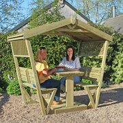 Stirling Arbour with people sat inside enjoying a cake